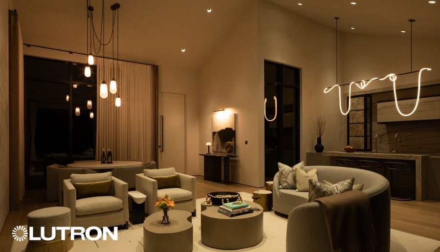 Modern living room with Lutron lighting control, featuring warm pendant and recessed lights for a cozy, inviting ambiance.